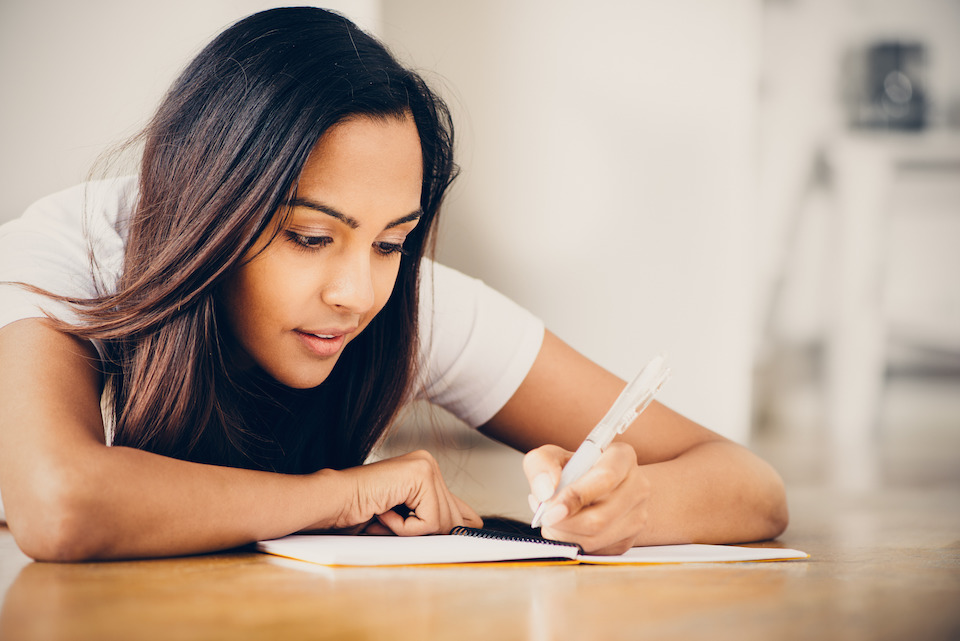 Woman writing at a desk